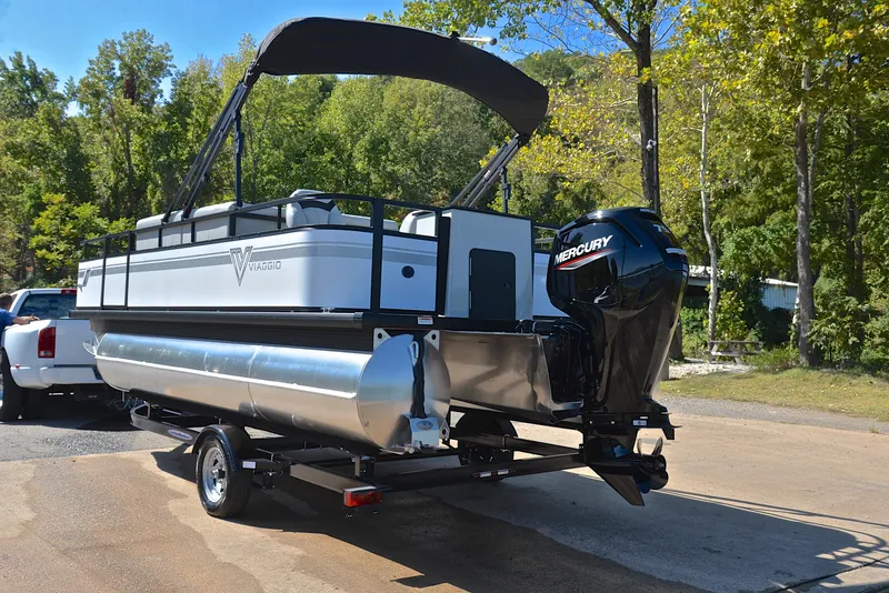 Slide: The Image of 2023 Viaggio DM18F pontoon boat with Mercury outboard motor on trailer. - 12