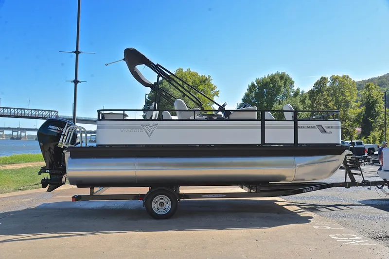 Slide: The Image of 2023 Viaggio DM18F pontoon boat on trailer by the river. - 15