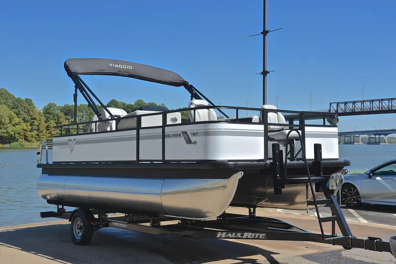 Slide: The Image of 2023 Viaggio DM18F pontoon boat on trailer by the lake. - 16