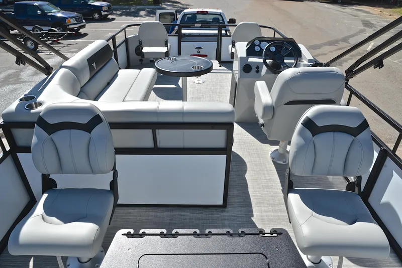 Slide: The Image of 2023 Viaggio DM18F pontoon boat interior with plush seating and modern dashboard. - 18