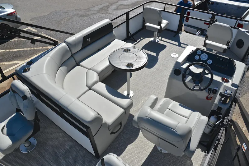 Slide: The Image of Viaggio DM18F 2023 pontoon boat interior with plush seating and modern helm. - 19