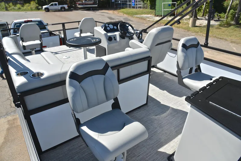Slide: The Image of 2023 Viaggio DM18F pontoon boat interior with plush seating and modern dashboard. - 21