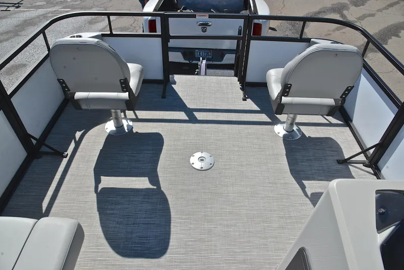 Slide: The Image of 2023 Viaggio DM18F boat interior with two swivel seats and gray flooring. - 24