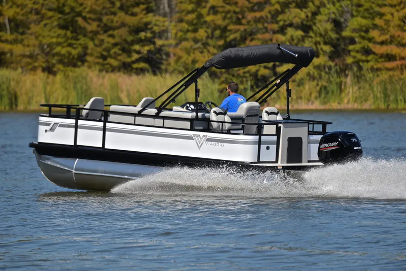 Slide: The Image of 2023 Viaggio DM18F pontoon boat cruising on a lake. - 4