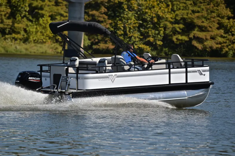 Slide: The Image of 2023 Viaggio DM18F pontoon boat cruising on a lake. - 5