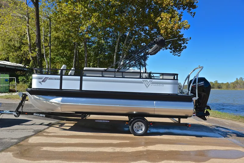 Slide: The Image of 2023 Viaggio DM18F pontoon boat on trailer by a lake. - 10