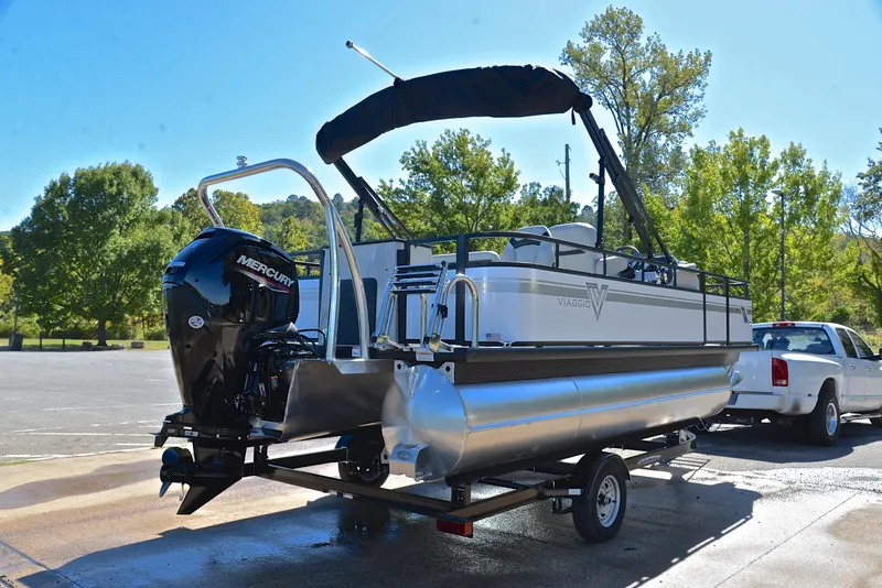 Slide: The Image of 2023 Viaggio DM18F pontoon boat on trailer with Mercury outboard motor. - 13