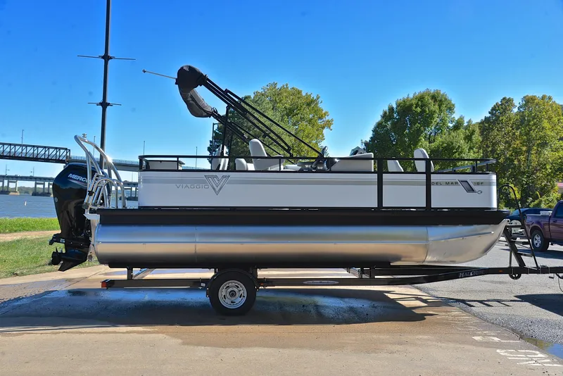 Slide: The Image of 2023 Viaggio DM18F pontoon boat on a trailer by the river. - 14