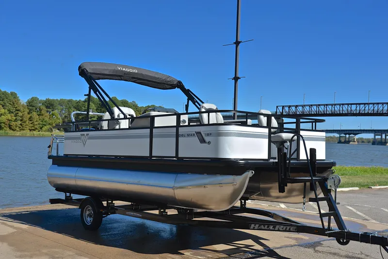 Slide: The Image of 2023 Viaggio DM18F pontoon boat on trailer by a lake. - 15