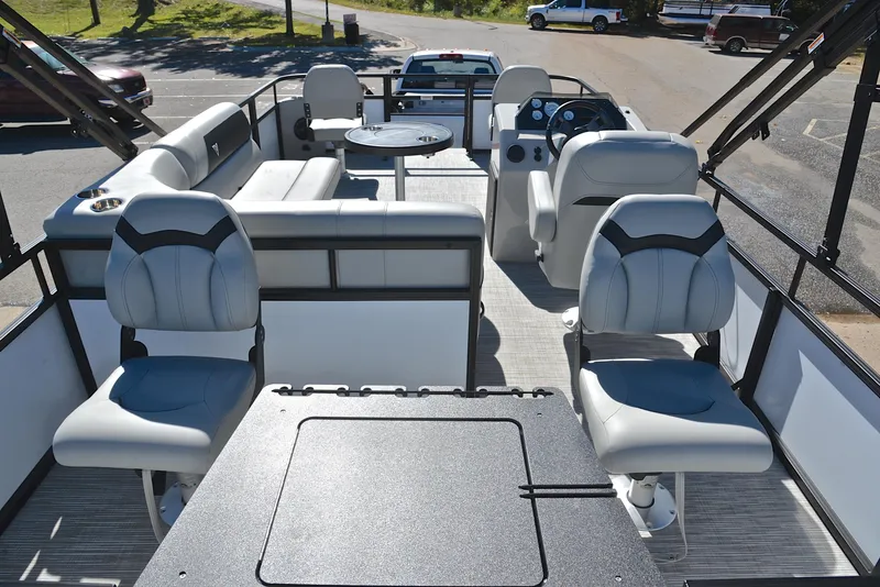 Slide: The Image of 2023 Viaggio DM18F pontoon boat interior with seating and steering console. - 17