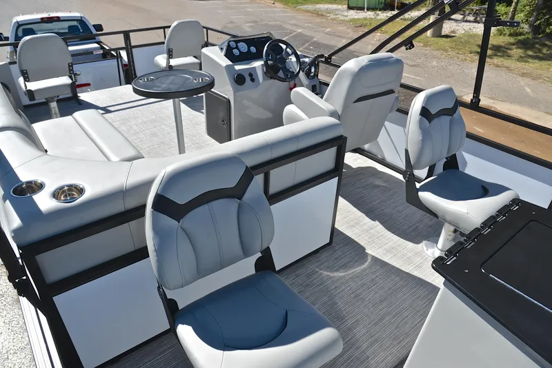 Slide: The Image of 2023 Viaggio DM18F pontoon boat interior with modern seating and steering console. - 22