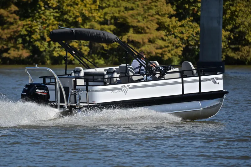 Slide: The Image of 2023 Viaggio DM18F pontoon boat cruising on a lake. - 5