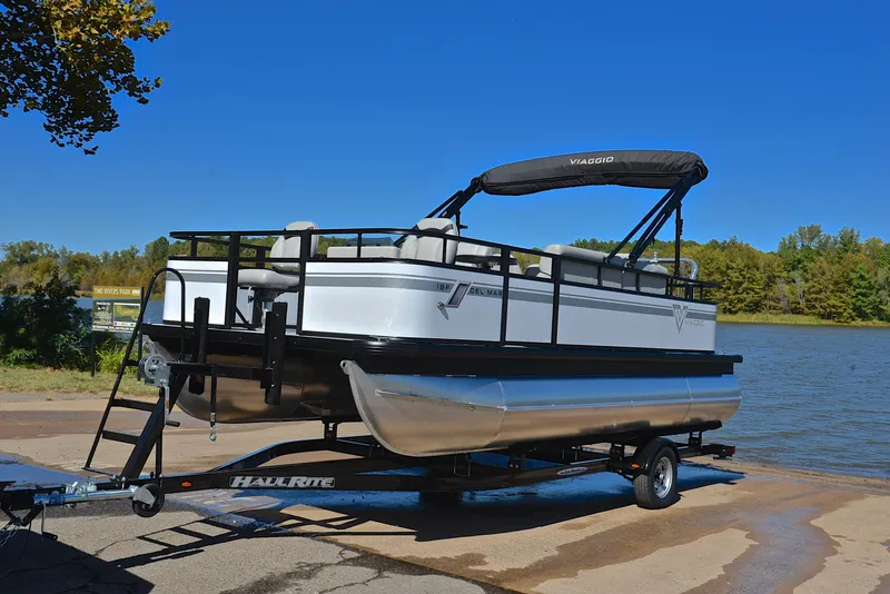 Slide: The Image of 2023 Viaggio DM18F pontoon boat on trailer by a lake. - 9