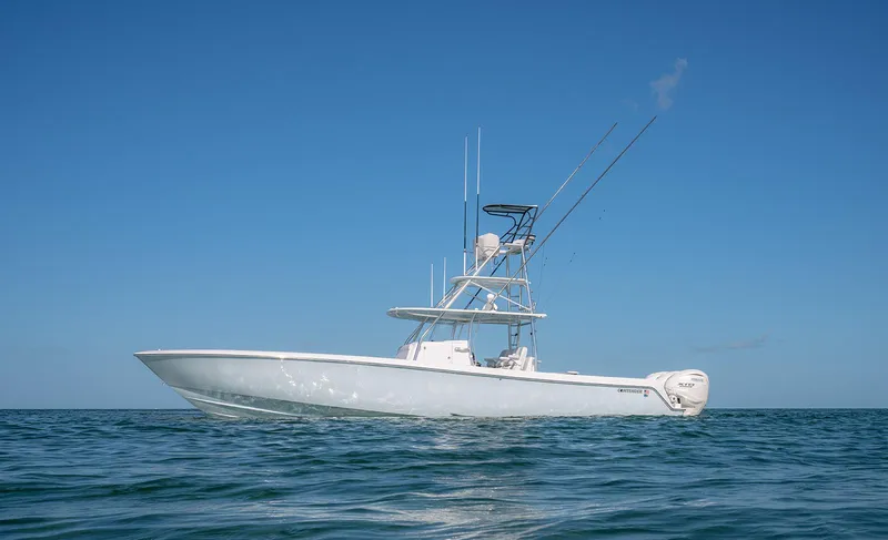 Slide: The Image of Contender 44 ST 2023 on open sea under clear sky. - 11