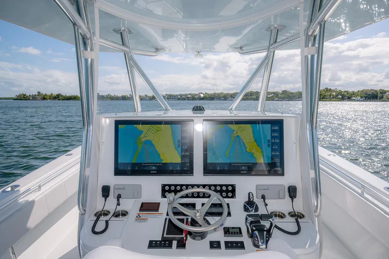 Slide: The Image of Cockpit of 2023 Contender 44 ST with navigation systems. - 16