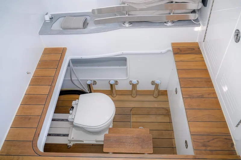 Slide: The Image of 2023 Contender 44 ST boat cabin with wooden flooring and toilet. - 18