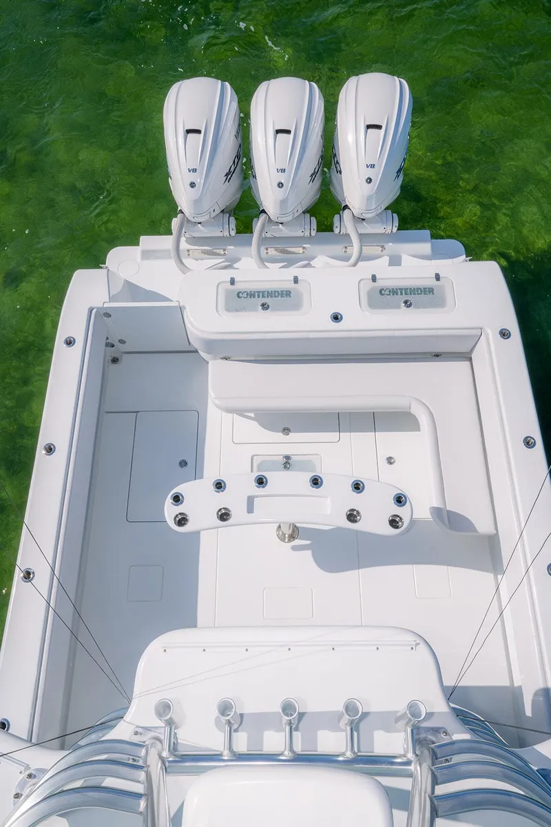 Slide: The Image of Aerial view of 2023 Contender 44 ST boat with three engines. - 19