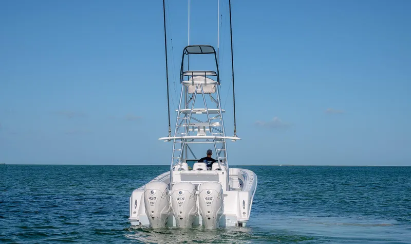 Slide: The Image of Contender 44 ST 2023 boat with four outboard engines on the sea. - 8