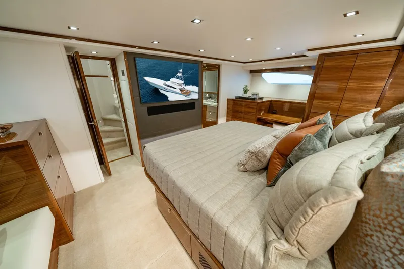 Slide: The Image of Luxurious bedroom interior of 2025 Viking 82 Convertible yacht with modern amenities. - 11