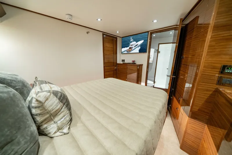 Slide: The Image of Luxurious bedroom interior of 2025 Viking 82 Convertible yacht with modern amenities. - 15