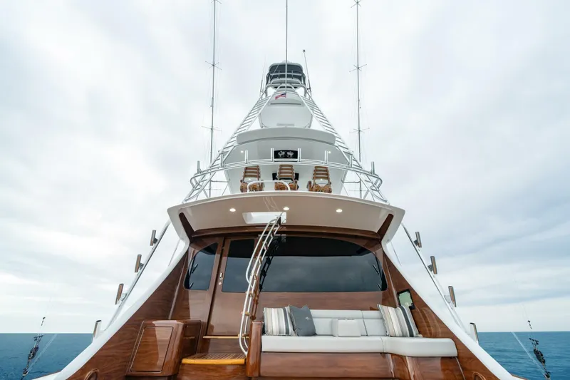 Slide: The Image of 2025 Viking 82 Convertible yacht with sleek design and luxurious seating on deck. - 30