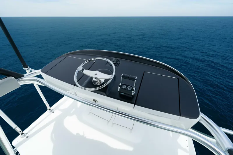 Slide: The Image of Helm of 2025 Viking 82 Convertible yacht overlooking the ocean. - 33