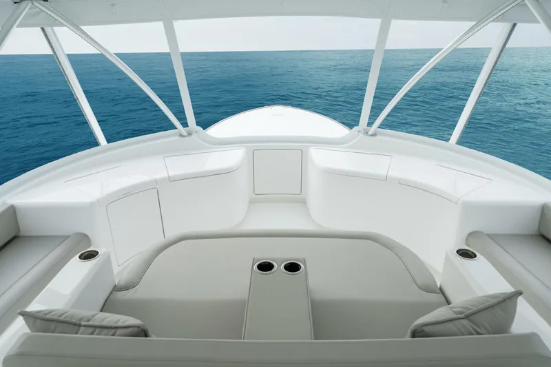 Slide: The Image of Luxurious seating area on 2025 Viking 82 Convertible yacht overlooking the ocean. - 38