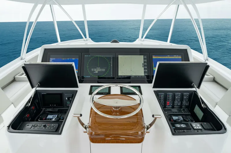 Slide: The Image of Helm of 2025 Viking 82 Convertible yacht with advanced navigation systems. - 39