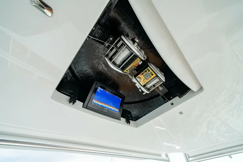 Slide: The Image of 2025 Viking 82 Convertible yacht interior with advanced navigation equipment. - 41