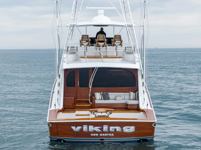 Slide: The Image of 2025 Viking 82 Convertible yacht on open sea, rear view. - 42