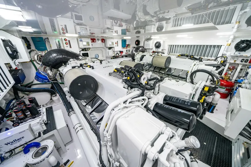 Slide: The Image of Engine room of 2025 Viking 82 Convertible yacht, showcasing advanced machinery and equipment. - 43