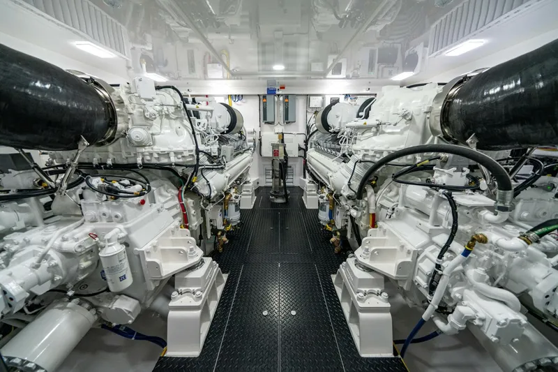 Slide: The Image of Engine room of 2025 Viking 82 Convertible yacht, showcasing powerful machinery and clean design. - 45
