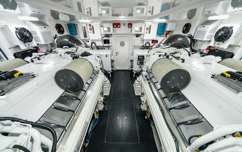 Slide: The Image of Engine room of 2025 Viking 82 Convertible yacht, featuring advanced machinery and equipment. - 46