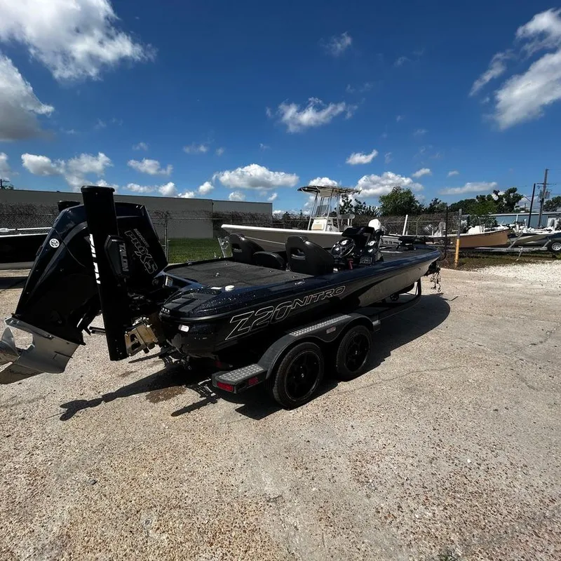 Slide: The Image of 2019 Nitro Z20 Pro fishing boat on a trailer under a clear blue sky. - 10