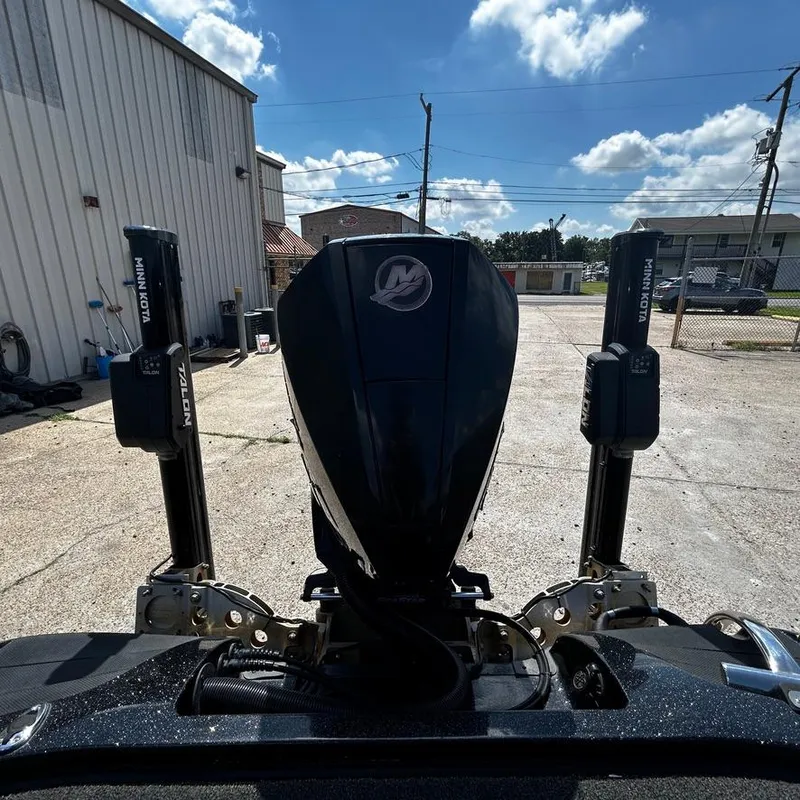 Slide: The Image of 2019 Nitro Z20 Pro boat engine and Minn Kota Talon anchors in a sunny outdoor setting. - 12