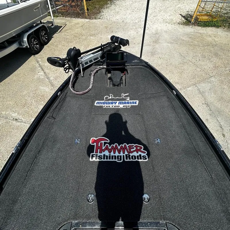 Slide: The Image of Top view of a 2019 Nitro Z20 Pro boat deck with fishing rod branding. - 15