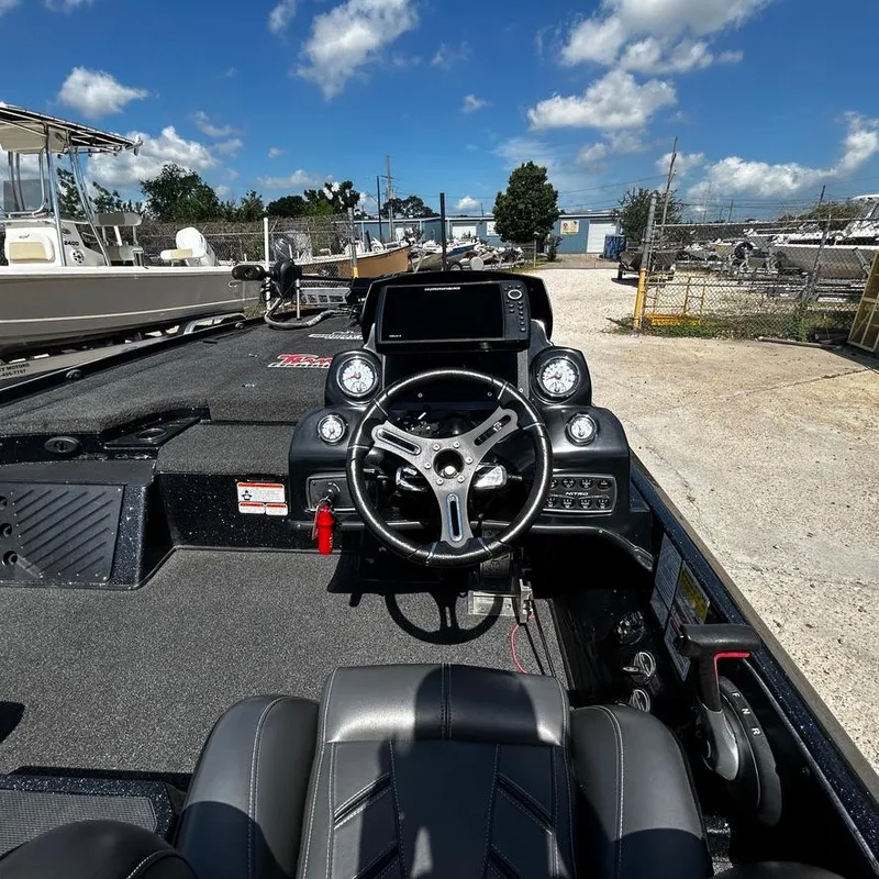 Slide: The Image of Nitro Z20 Pro 2019 boat dashboard with steering wheel and control panel. - 16