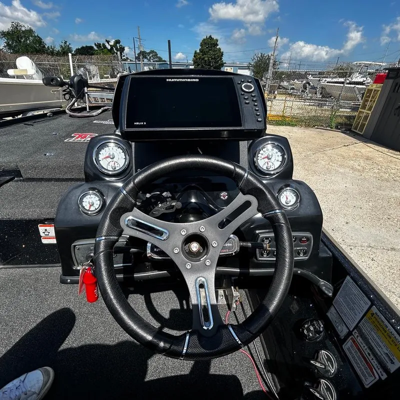 Slide: The Image of Nitro Z20 Pro 2019 boat dashboard with steering wheel and navigation system. - 17