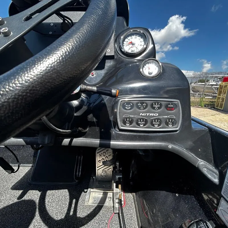 Slide: The Image of Close-up of the dashboard and controls of a 2019 Nitro Z20 Pro boat. - 18