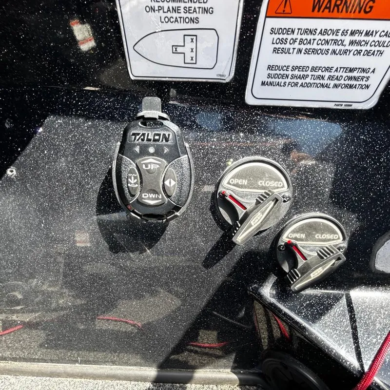 Slide: The Image of Control panel of a 2019 Nitro Z20 Pro boat with Talon remote and warning labels. - 20