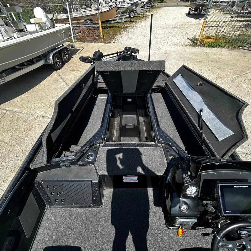Slide: The Image of 2019 Nitro Z20 Pro fishing boat interior with open storage compartments. - 22