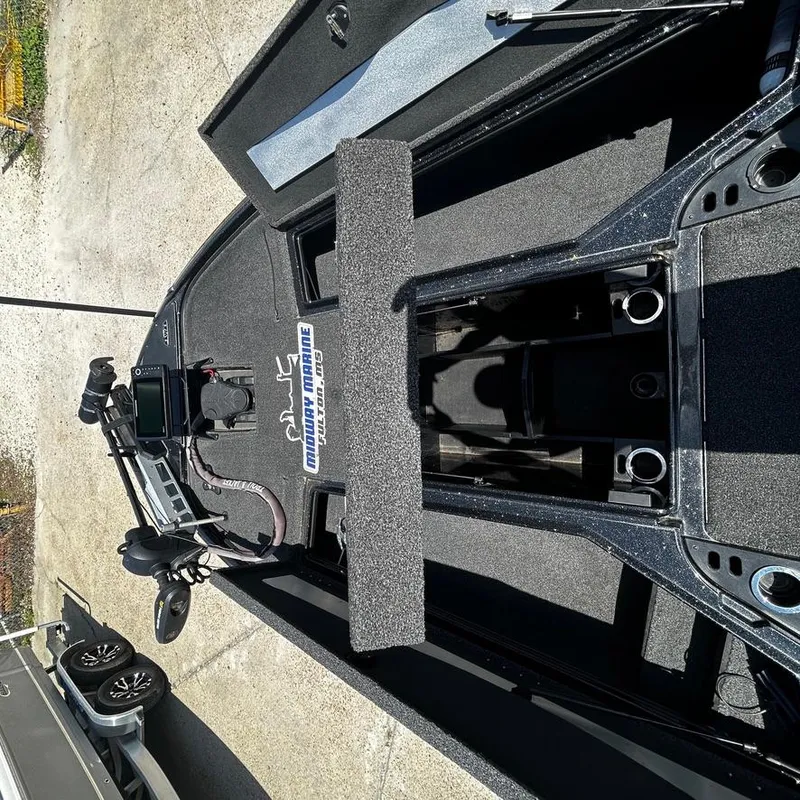Slide: The Image of Nitro Z20 Pro 2019 boat interior with open storage compartments and fishing equipment. - 23
