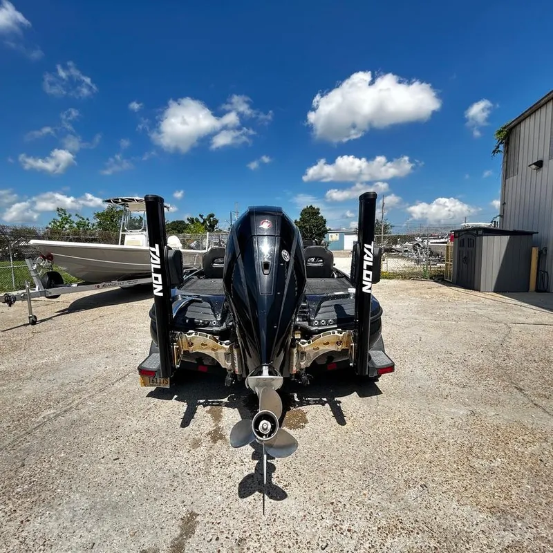 Slide: The Image of 2019 Nitro Z20 Pro boat with Talon anchors, rear view, parked outdoors. - 3