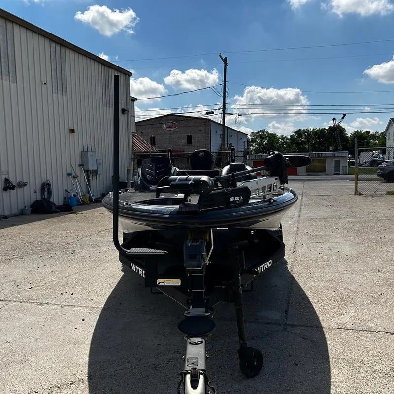 Slide: The Image of Nitro Z20 Pro 2019 boat parked outside industrial building under blue sky. - 7