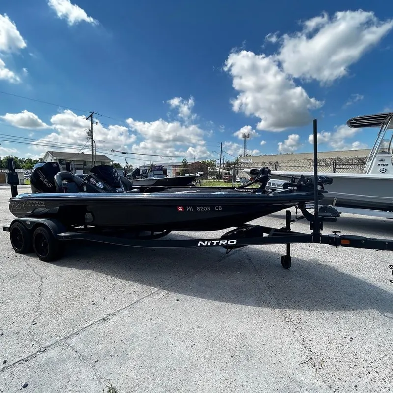 Slide: The Image of 2019 Nitro Z20 Pro boat on trailer under a blue sky with clouds. - 8