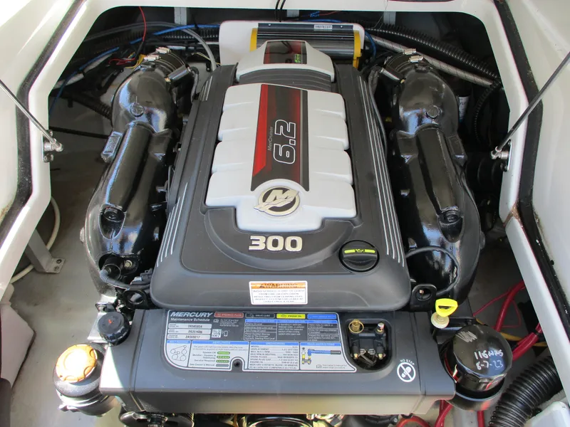 Slide: The Image of 2019 Crownline Eclipse E255 boat engine compartment with a 6.2L Mercury 300 HP engine. - 11
