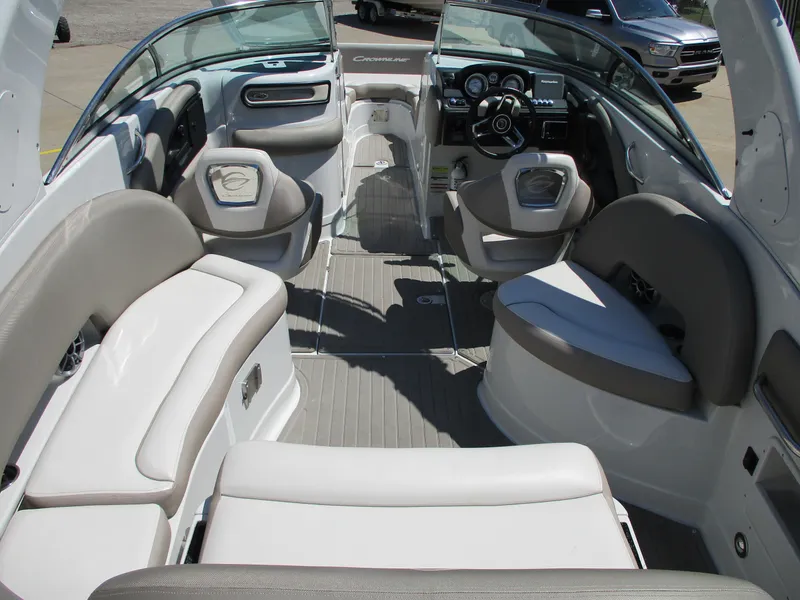 Slide: The Image of 2019 Crownline Eclipse E255 boat interior with spacious seating and modern dashboard. - 4