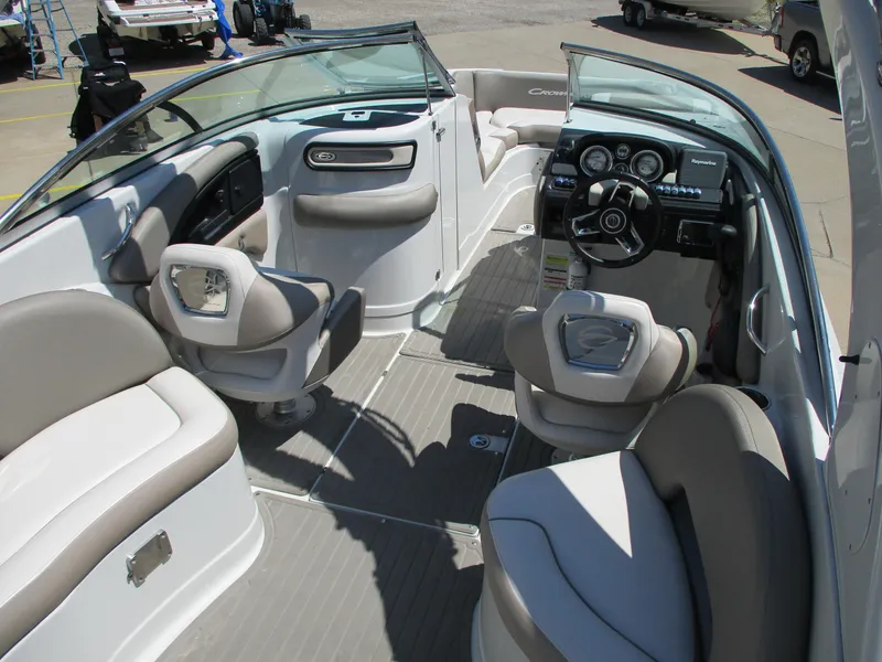 Slide: The Image of 2019 Crownline Eclipse E255 boat interior with seating and dashboard. - 5