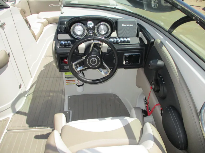 Slide: The Image of 2019 Crownline Eclipse E255 boat cockpit with steering wheel and dashboard. - 6