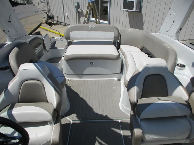 Slide: The Image of 2019 Crownline Eclipse E255 boat interior with gray and white seating. - 8